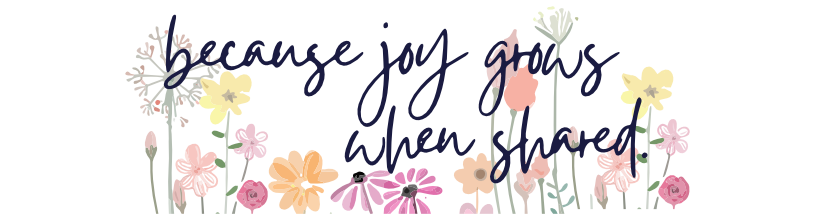The phrase 'because joy grows when shared.' is written in dark navy blue cursive script on a floral background.